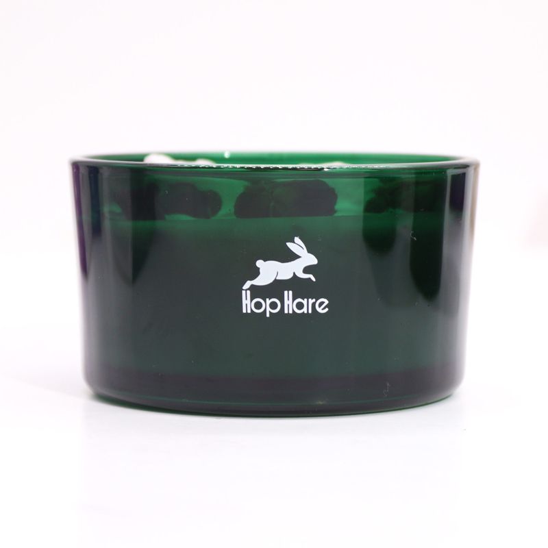 Deep green glass jar used for Hop Hare Crystal Magic Flower Candles