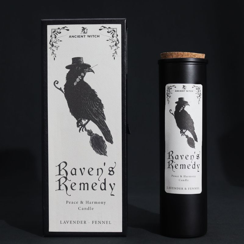 Raven's Remedy ritual candle and raven gift box on a black background