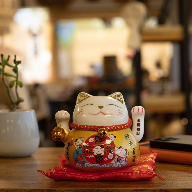 Ceramic Money Cat Moving Hand - Gold on Cushion (battery not included)