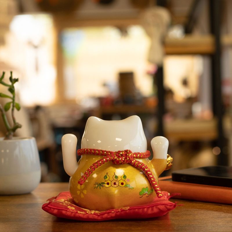 Ceramic Money Cat Moving Hand - Gold on Cushion (battery not included)
